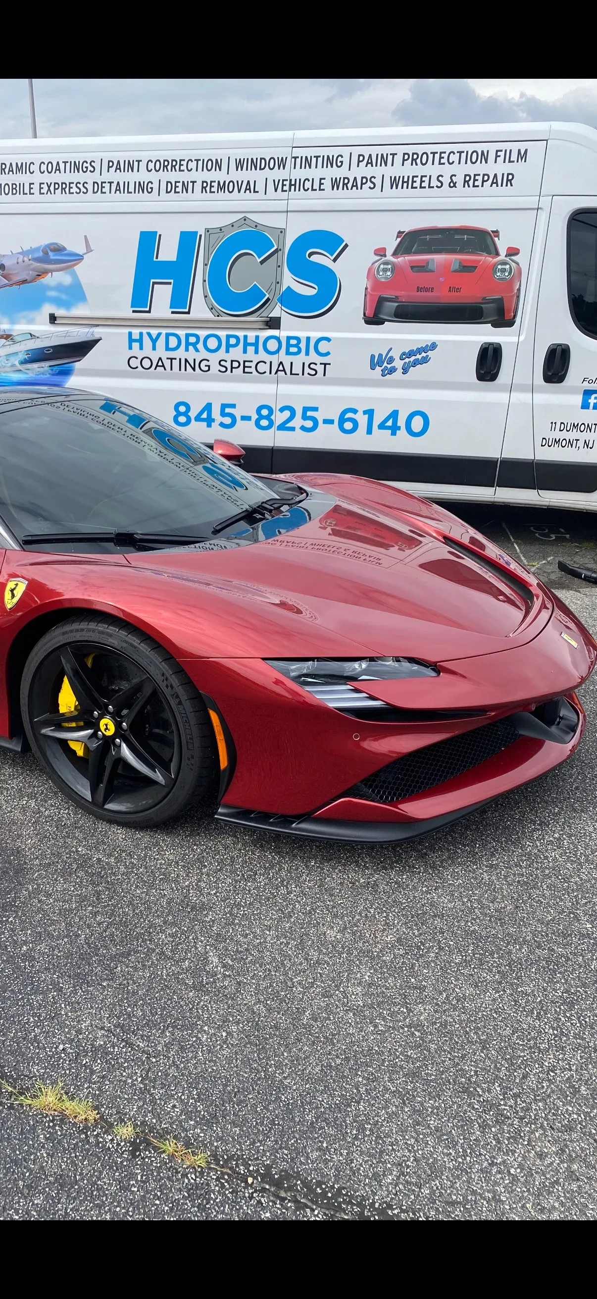 Ferrari with a glossy, well-corrected paint finish parked in front of the HCS service van