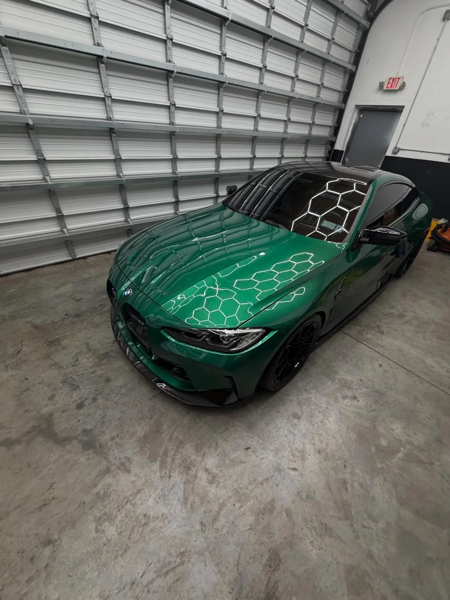 Emerald green BMW with a glossy exterior finish